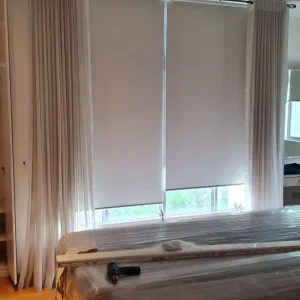 Sheer curtain and roller blind